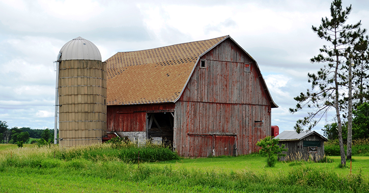 farmhouse with silo agricultural land